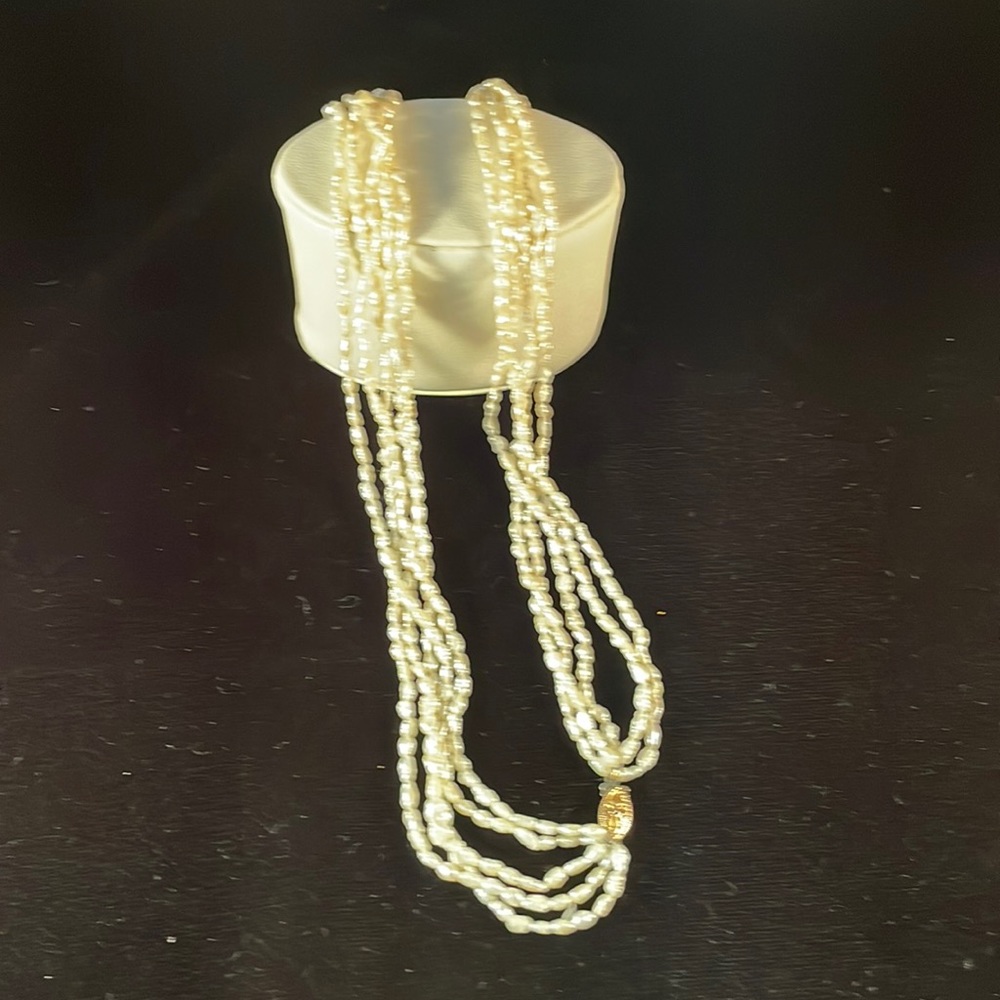 Five strand seed pearl necklace with gold clasp. 18”